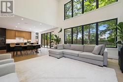 Two-Storey Living Room is Open to Dream Kitchen -