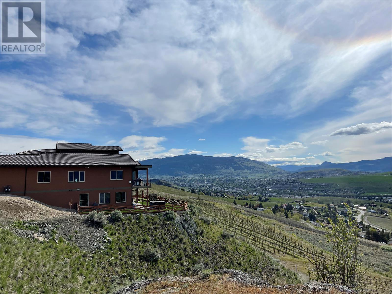 View across vineyards to the hills in the distance - 595 Vineyard Way N Lot# 33, Vernon, BC