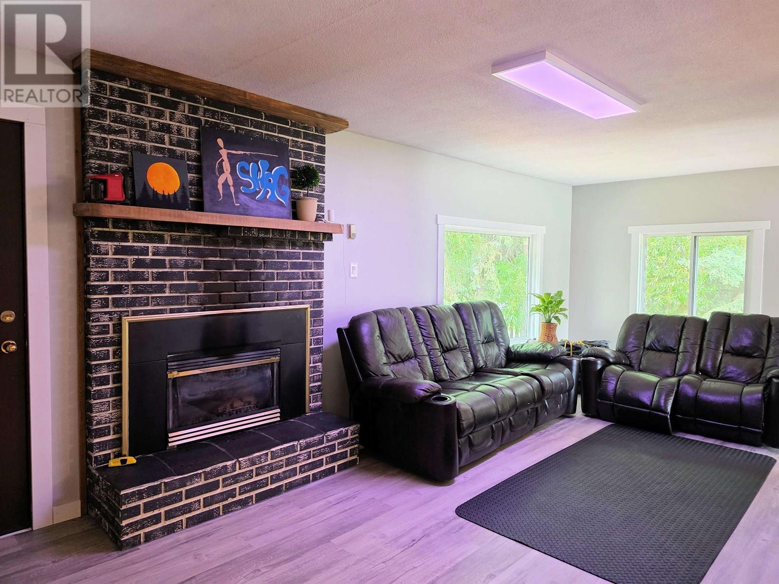 2512 Dominion Avenue, Houston, BC - Indoor Photo Showing Living Room With Fireplace