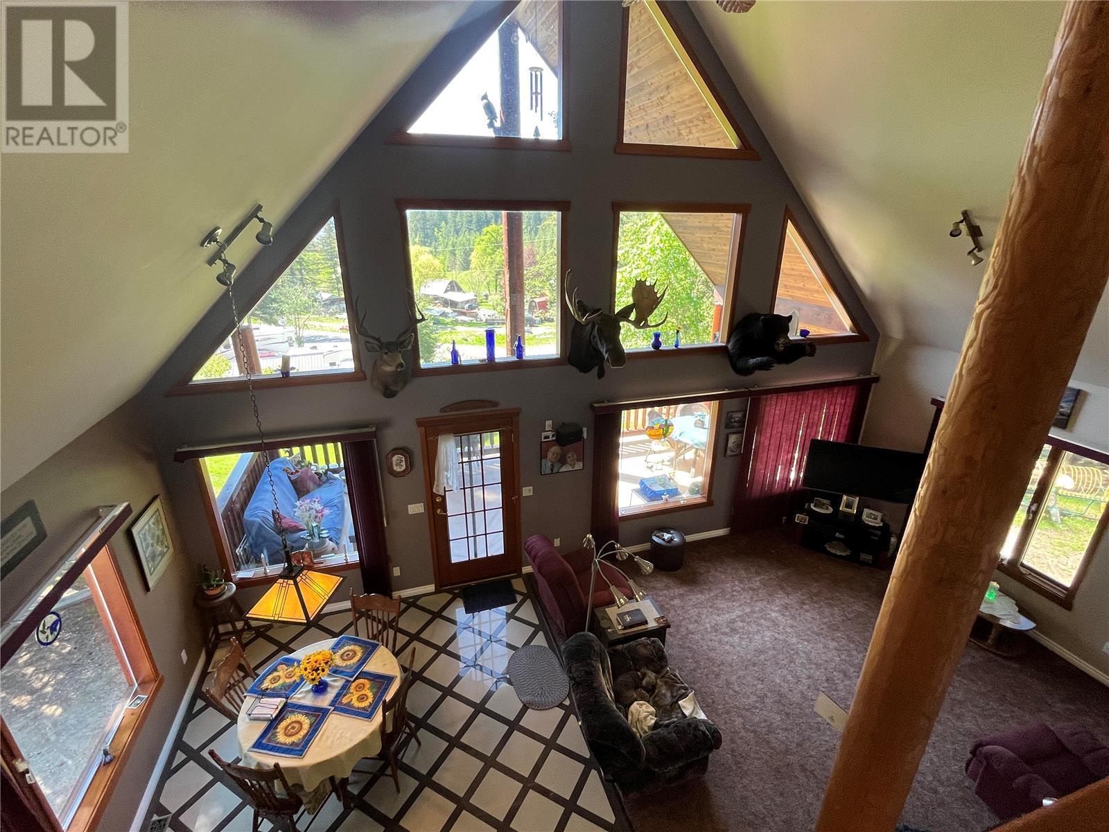 2 story living room - 645 Badger Road, Tappen, BC