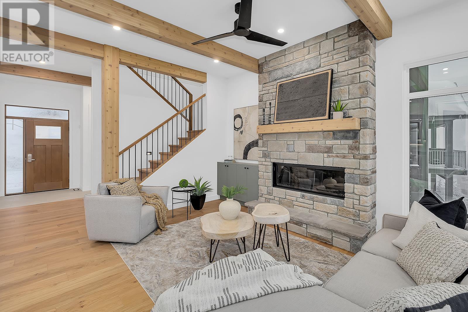 255 Feathertop Way Unit# 82, Big White, BC - Indoor Photo Showing Living Room With Fireplace