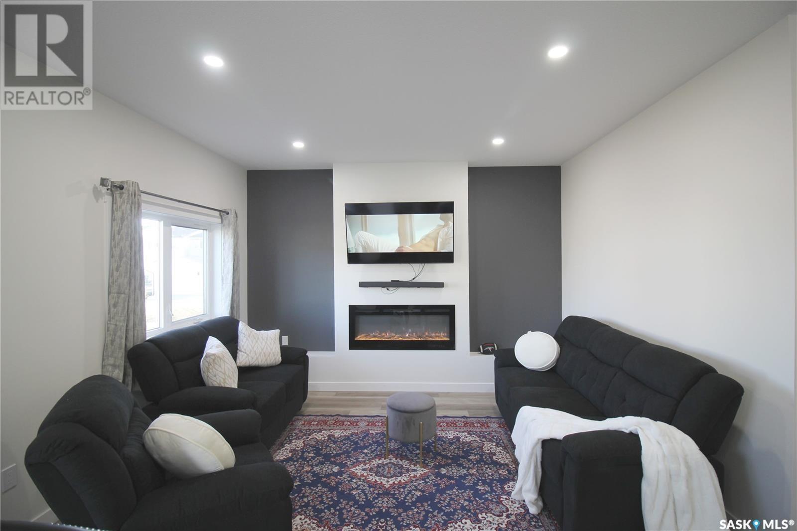 3005 Dumont Way, Regina, SK - Indoor Photo Showing Living Room With Fireplace