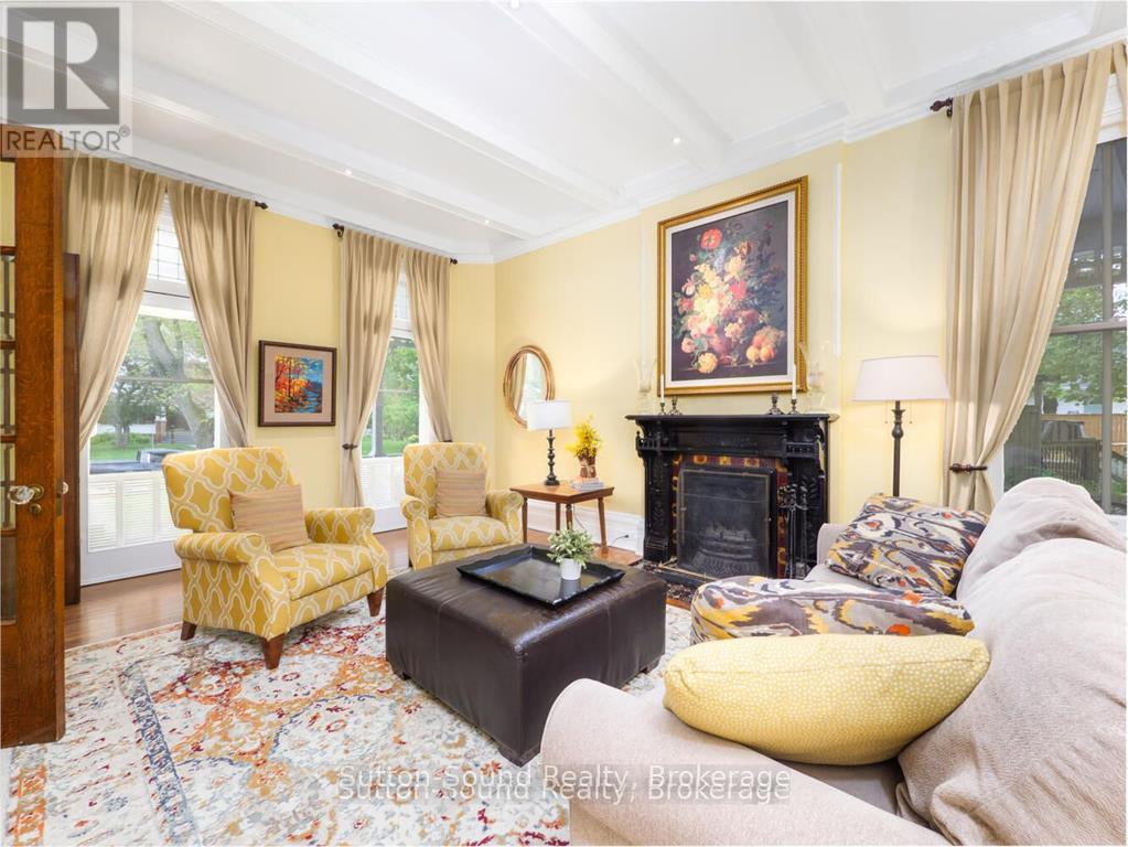 Grand Parlor room with wood fireplace - 932 3Rd Avenue W, Owen Sound, ON - Indoor Photo Showing Living Room With Fireplace