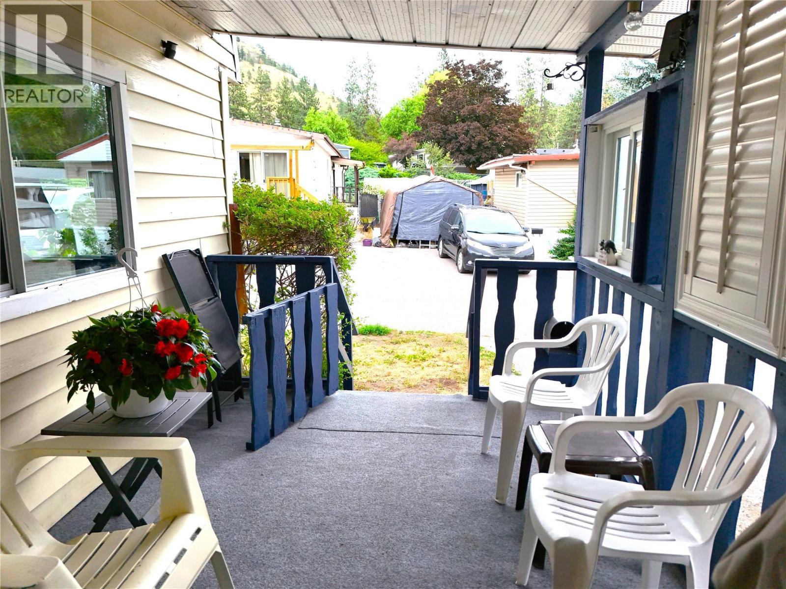 Covered Front Porch Looking Out - 1999 97 Highway S Unit# 197, Kelowna, BC