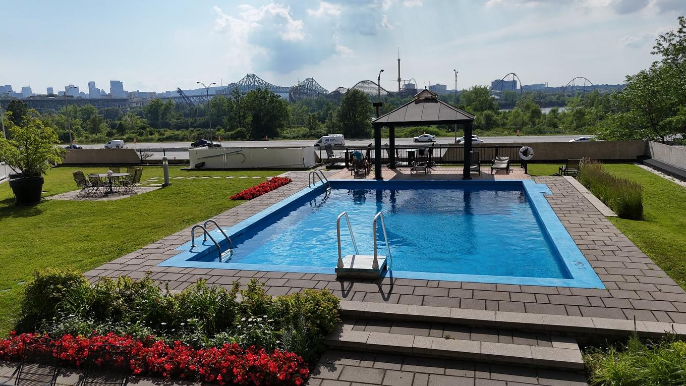 Pool - T301-51 Place Charles-Le Moyne, Longueuil (Le Vieux-Longueuil), QC - Outdoor With In Ground Pool With Backyard