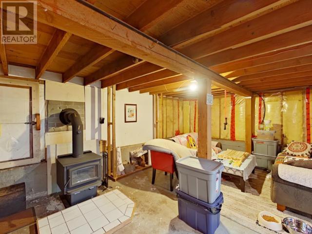 2545 Smelter Ave, Texada Island, BC - Indoor Photo Showing Basement With Fireplace