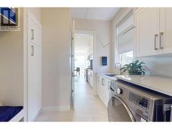Laundry room located just off the kitchen -
