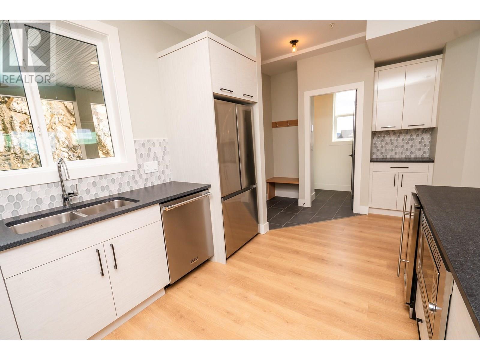 270A Grizzly Ridge Trail, Big White, BC - Indoor Photo Showing Kitchen With Stainless Steel Kitchen With Double Sink