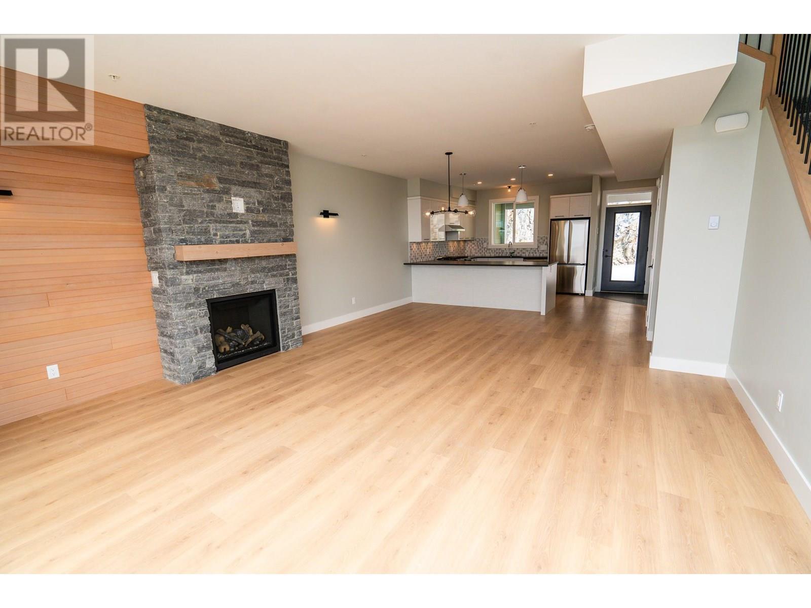 270A Grizzly Ridge Trail, Big White, BC - Indoor Photo Showing Living Room With Fireplace