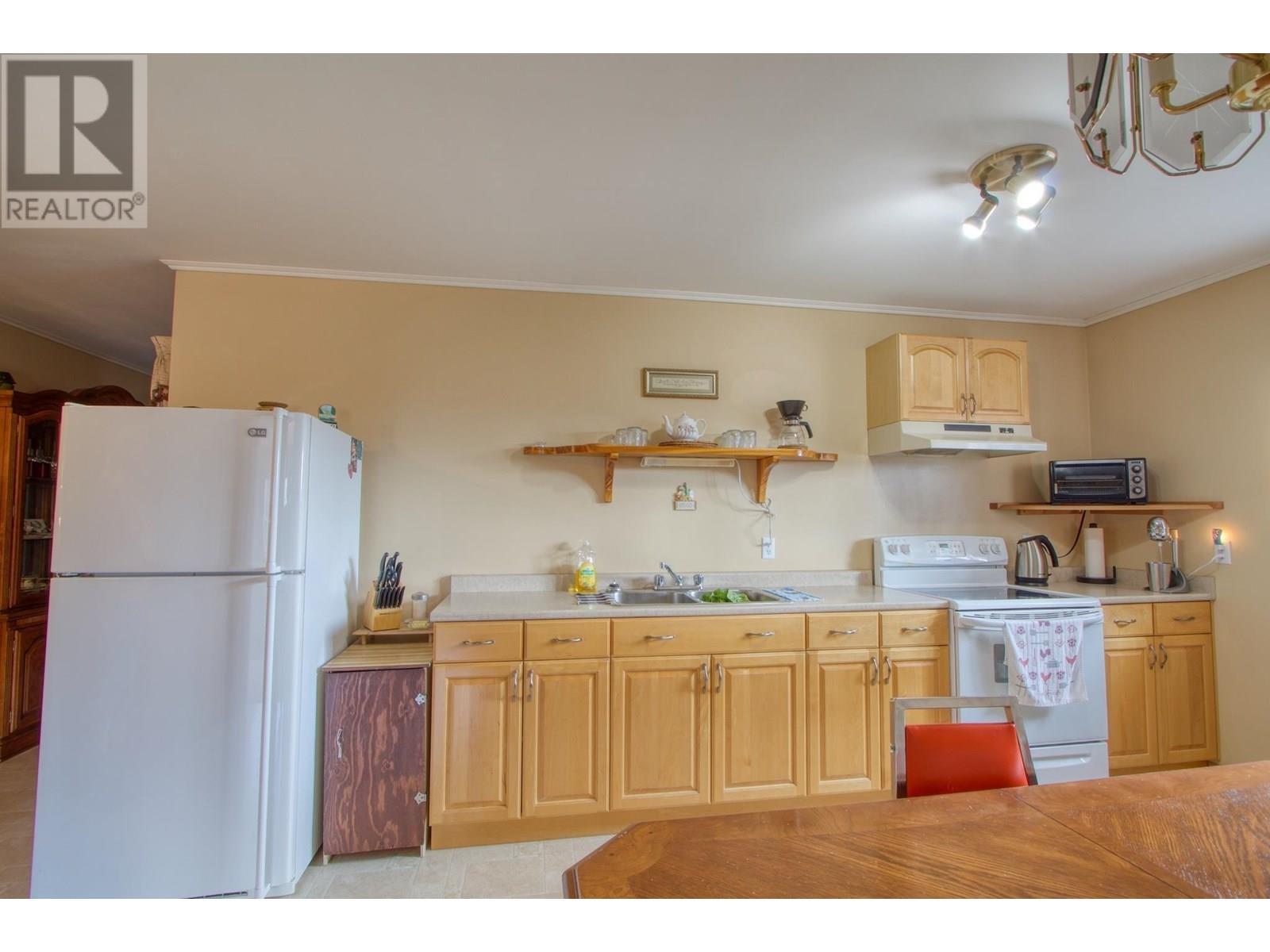 3988 S Cariboo 97 Highway, Lac La Hache, BC - Indoor Photo Showing Kitchen With Double Sink