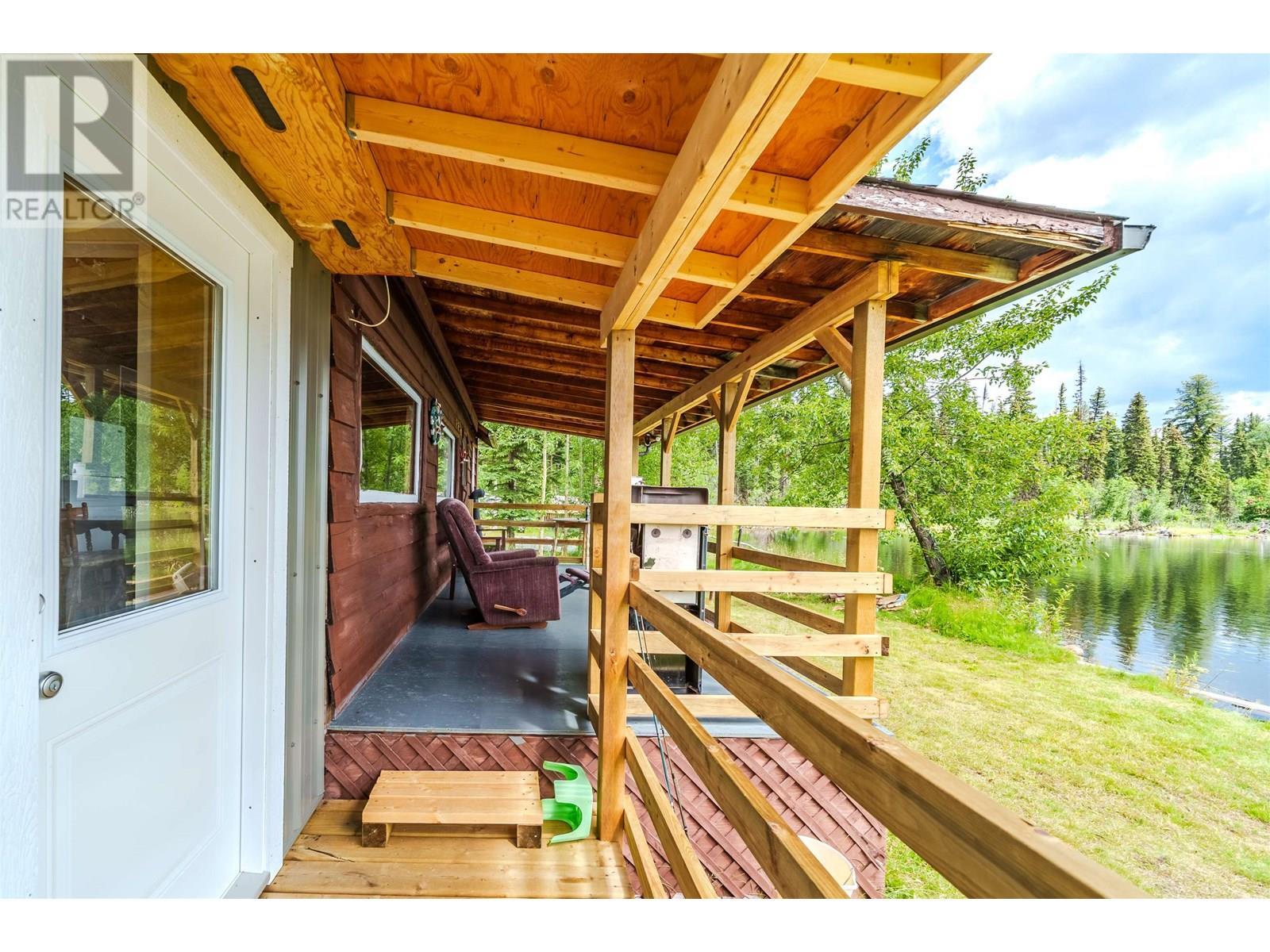 4778 Binnie Road, Lac La Hache, BC - Outdoor With Body Of Water With Deck Patio Veranda With Exterior