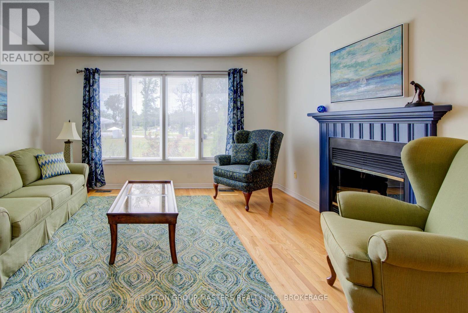3 Abbey Dawn Drive, Loyalist (Bath), ON - Indoor Photo Showing Living Room With Fireplace