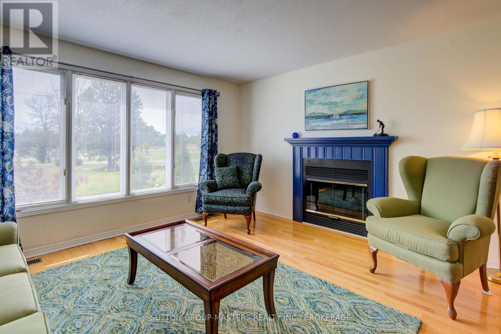 3 Abbey Dawn Drive, Loyalist (Bath), ON - Indoor Photo Showing Living Room With Fireplace