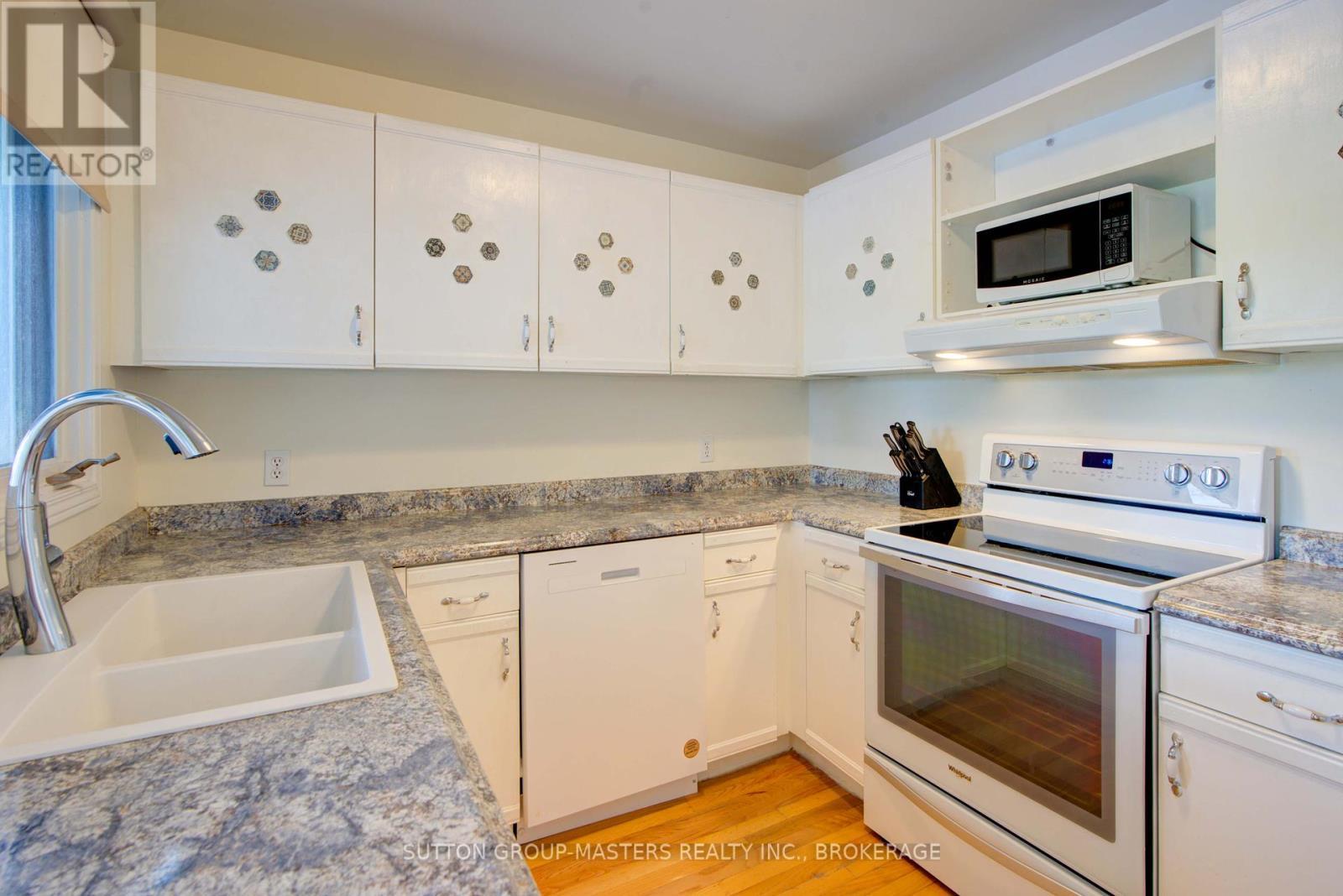 Kitchen with deck walkout - 3 Abbey Dawn Drive, Loyalist (Bath), ON - Indoor Photo Showing Kitchen With Double Sink
