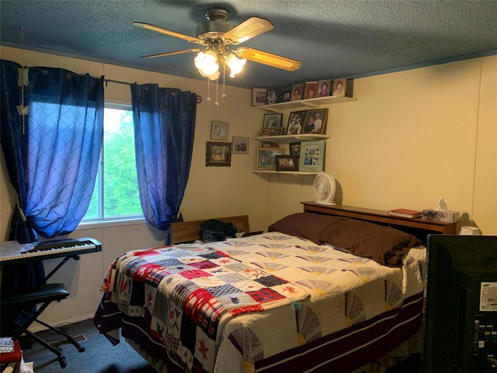 Plenty of room in the primary bedroom with a full wall closet. - 3 Reiland Bay, Gladstone, MB - Indoor Photo Showing Bedroom