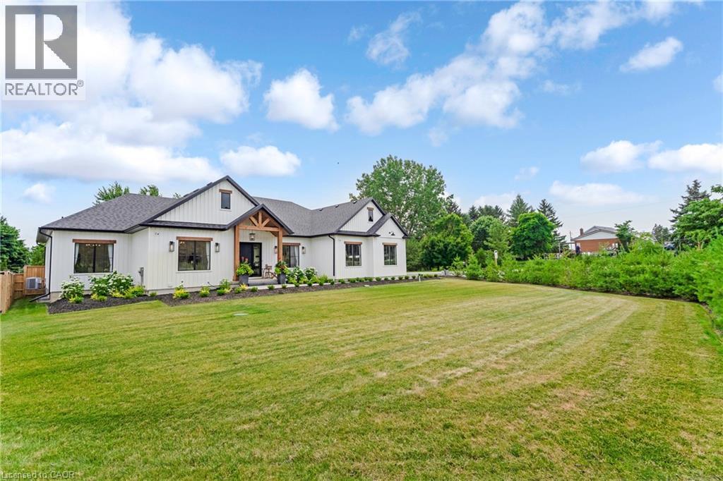 Modern inspired farmhouse with a front yard - 4678 Lobsinger Line, Crosshill, ON - Outdoor