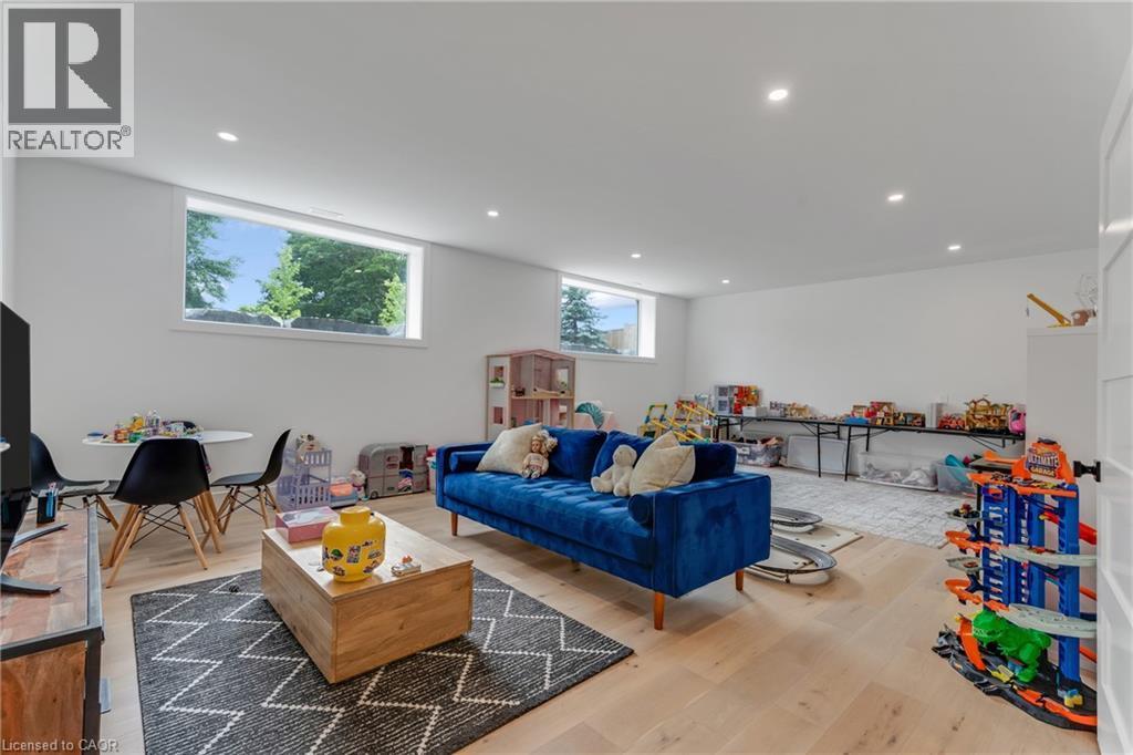 Living room featuring wood finished floors and recessed lighting - 4678 Lobsinger Line, Crosshill, ON - Indoor