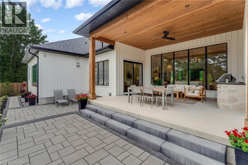 View of patio / terrace with a ceiling fan, outdoor dining area, and an outdoor kitchen - 4678 Lobsinger Line, Crosshill, ON - Outdoor With Deck Patio Veranda With Exterior