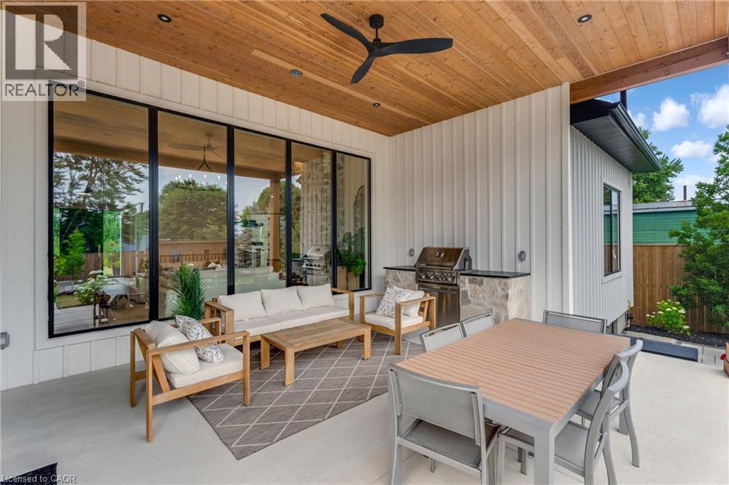 View of patio with an outdoor kitchen and a ceiling fan - 4678 Lobsinger Line, Crosshill, ON - Outdoor With Deck Patio Veranda With Exterior