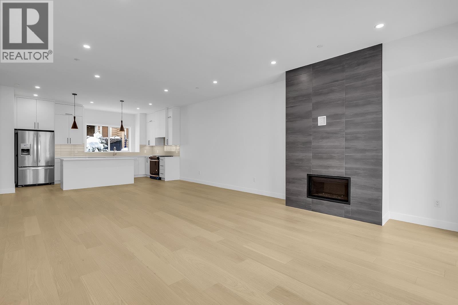 Images similar to and subject to change. - 4495 Walker Road Unit# 1, Kelowna, BC - Indoor With Fireplace