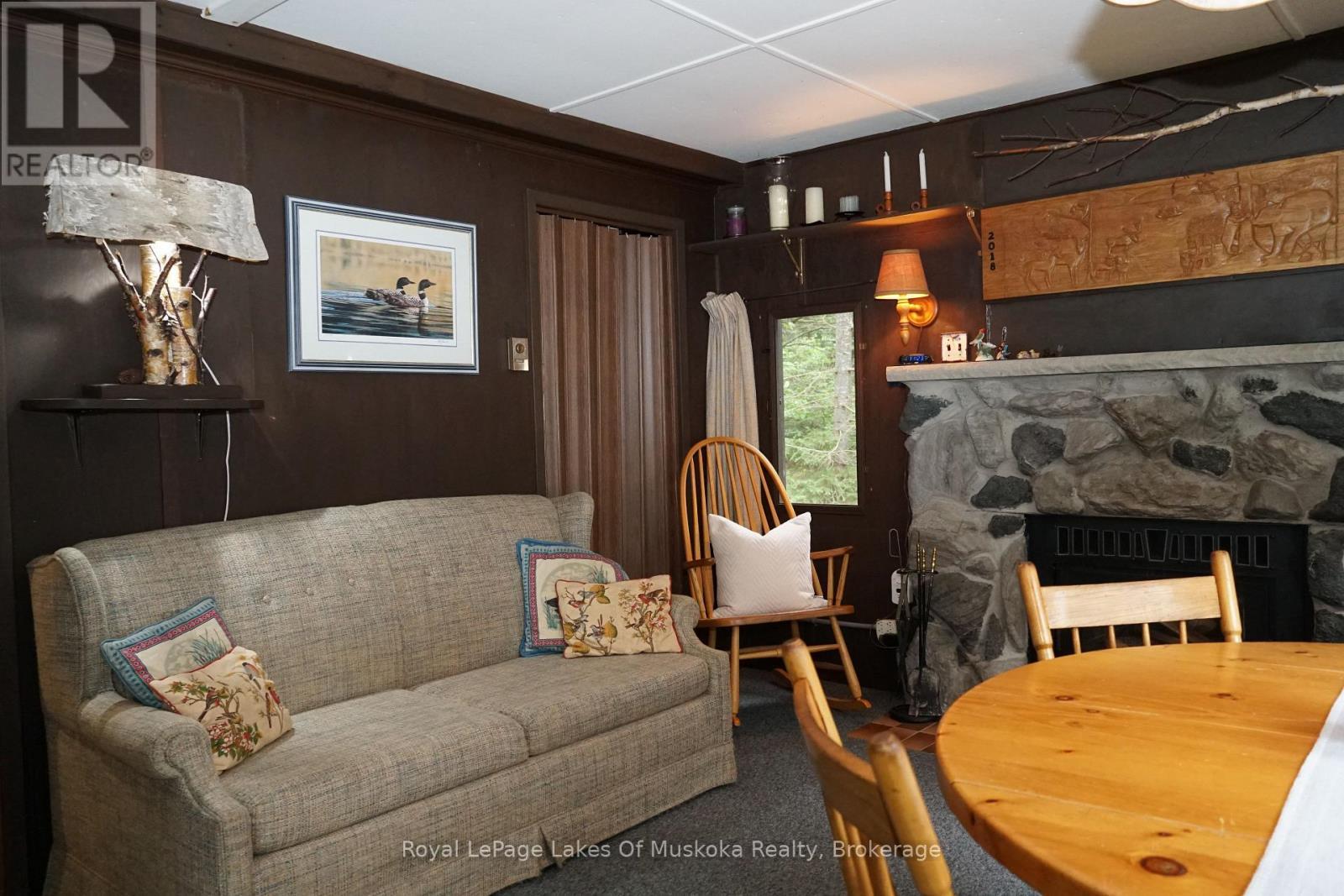 1173 Lake Of Two Rivers, South Algonquin, ON - Indoor Photo Showing Dining Room With Fireplace
