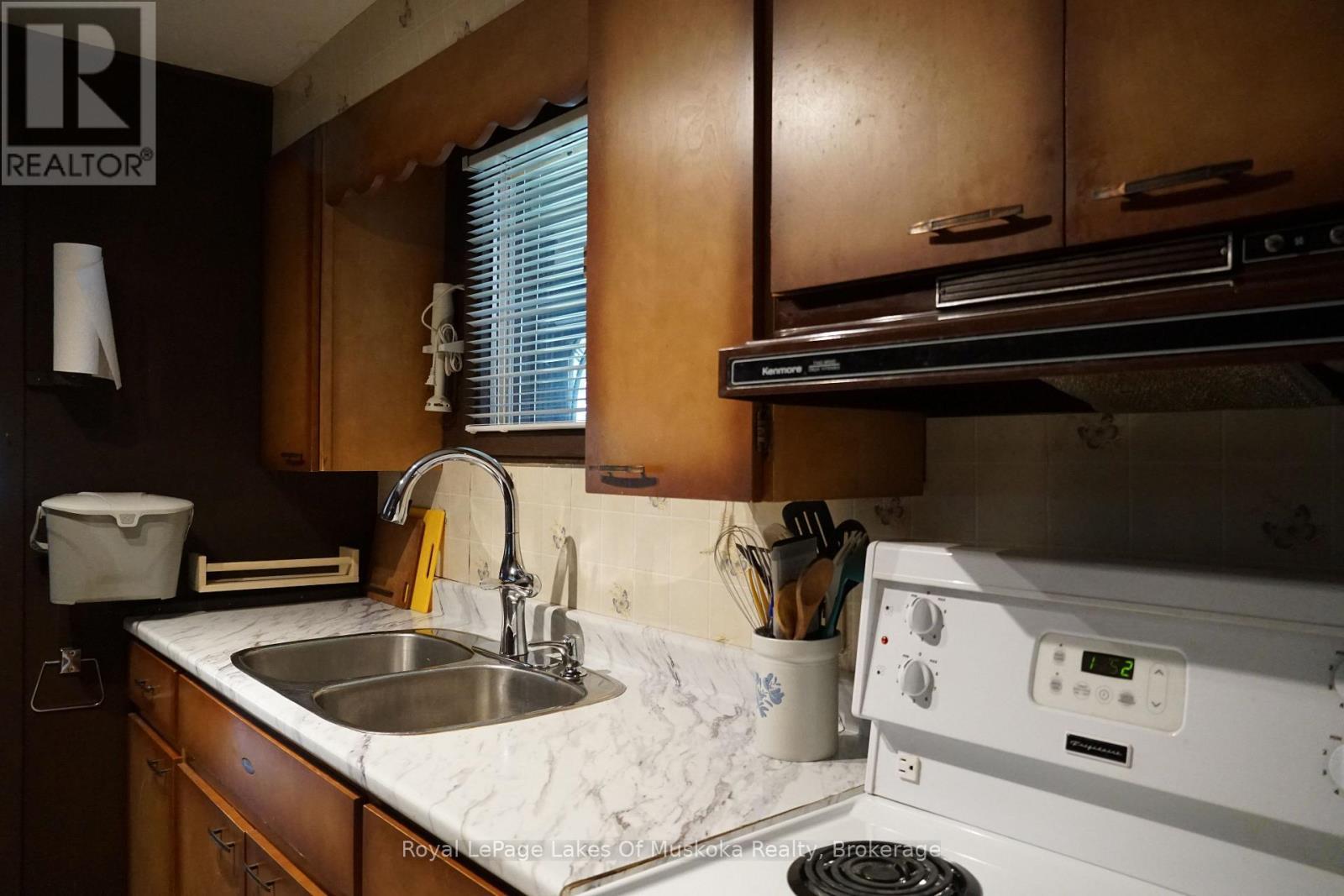 1173 Lake Of Two Rivers, South Algonquin, ON - Indoor Photo Showing Kitchen With Double Sink