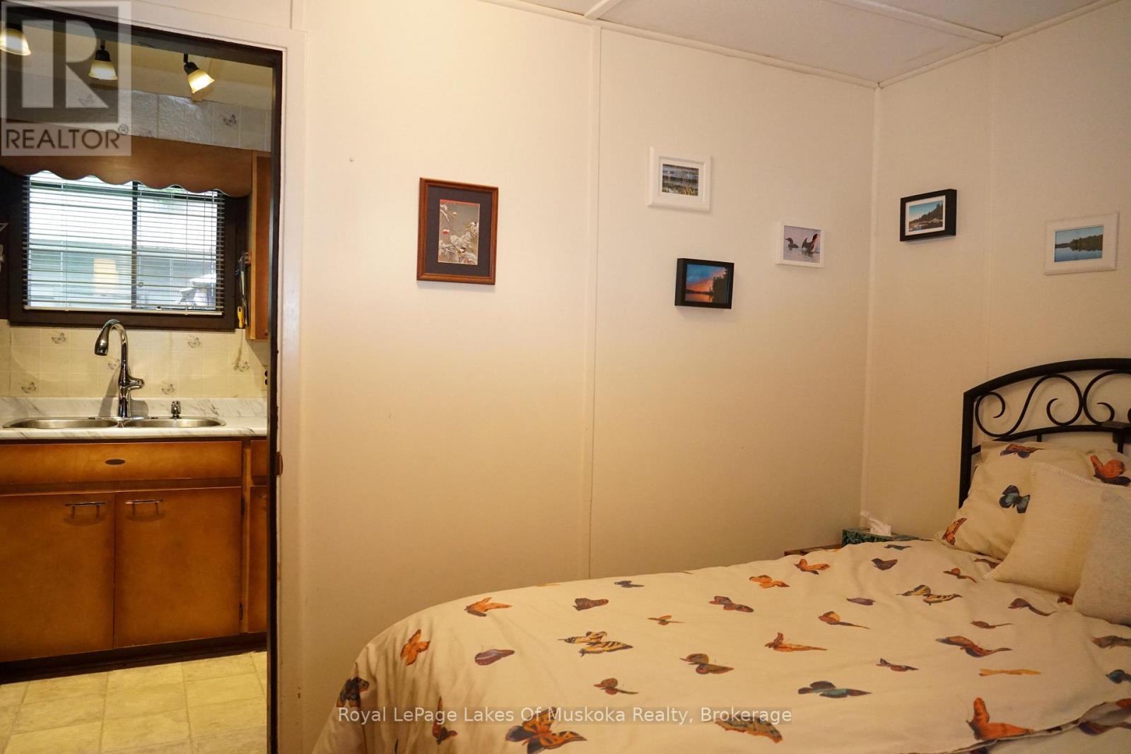 1173 Lake Of Two Rivers, South Algonquin, ON - Indoor Photo Showing Bedroom