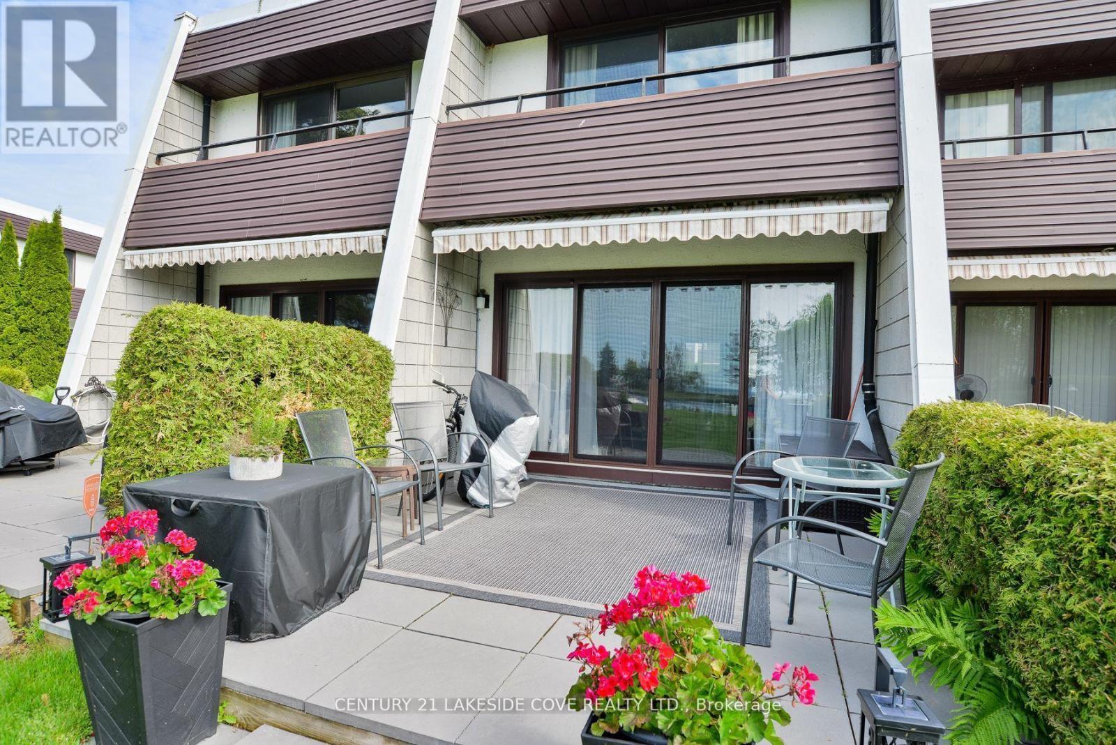 Private Waterside Patio / Awning - Unit 14 - 1 Paradise Boulevard, Ramara, ON - Outdoor With Exterior