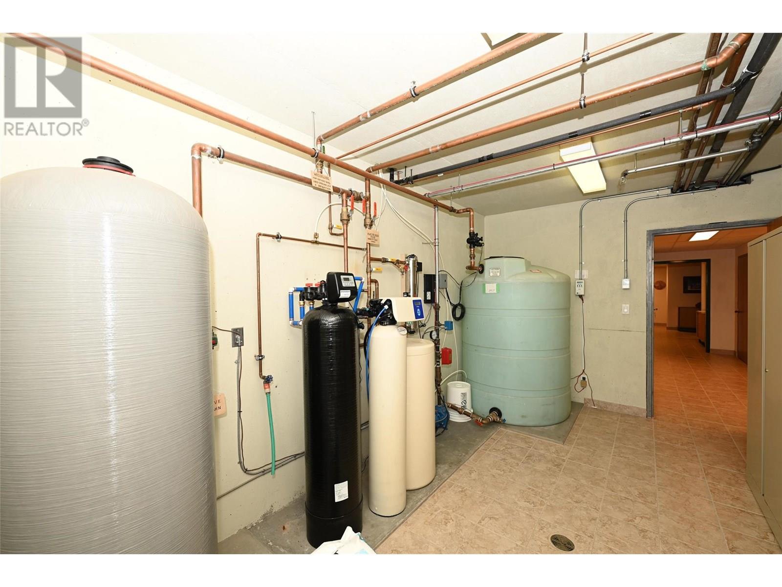 Utility room for well, water treatment & sprinkler system reservoir - 202 Stepping Stones Crescent, Spallumcheen, BC