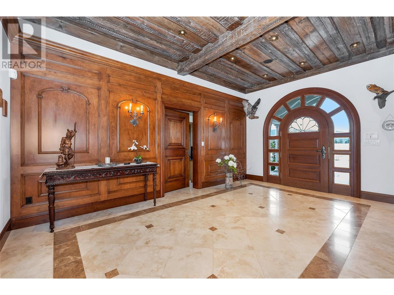 Grand foyer with hand carved wood ceiling from 1786 - 202 Stepping Stones Crescent, Spallumcheen, BC