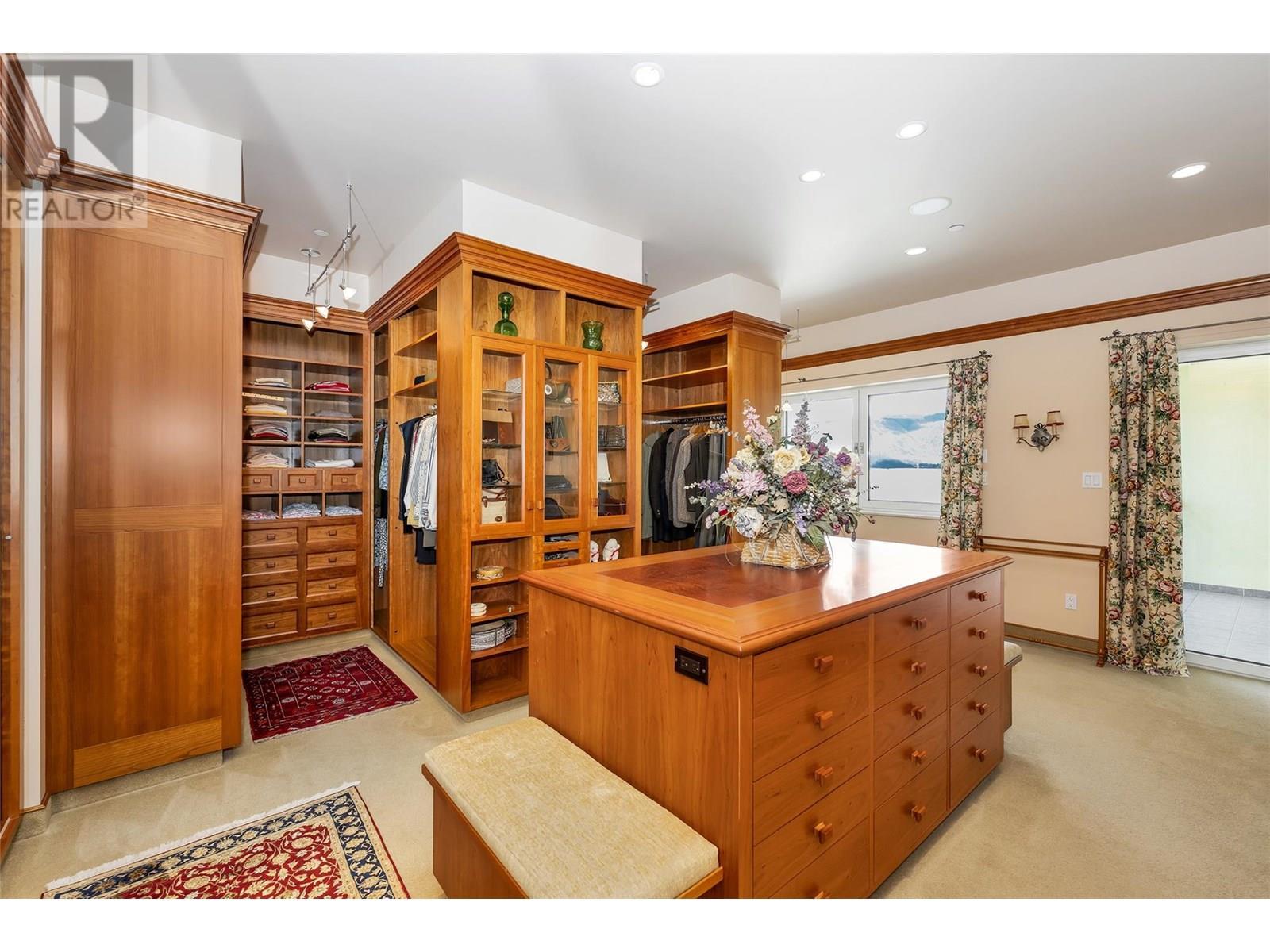 island counter with Burl Cherry wood veneered inlays - 202 Stepping Stones Crescent, Spallumcheen, BC