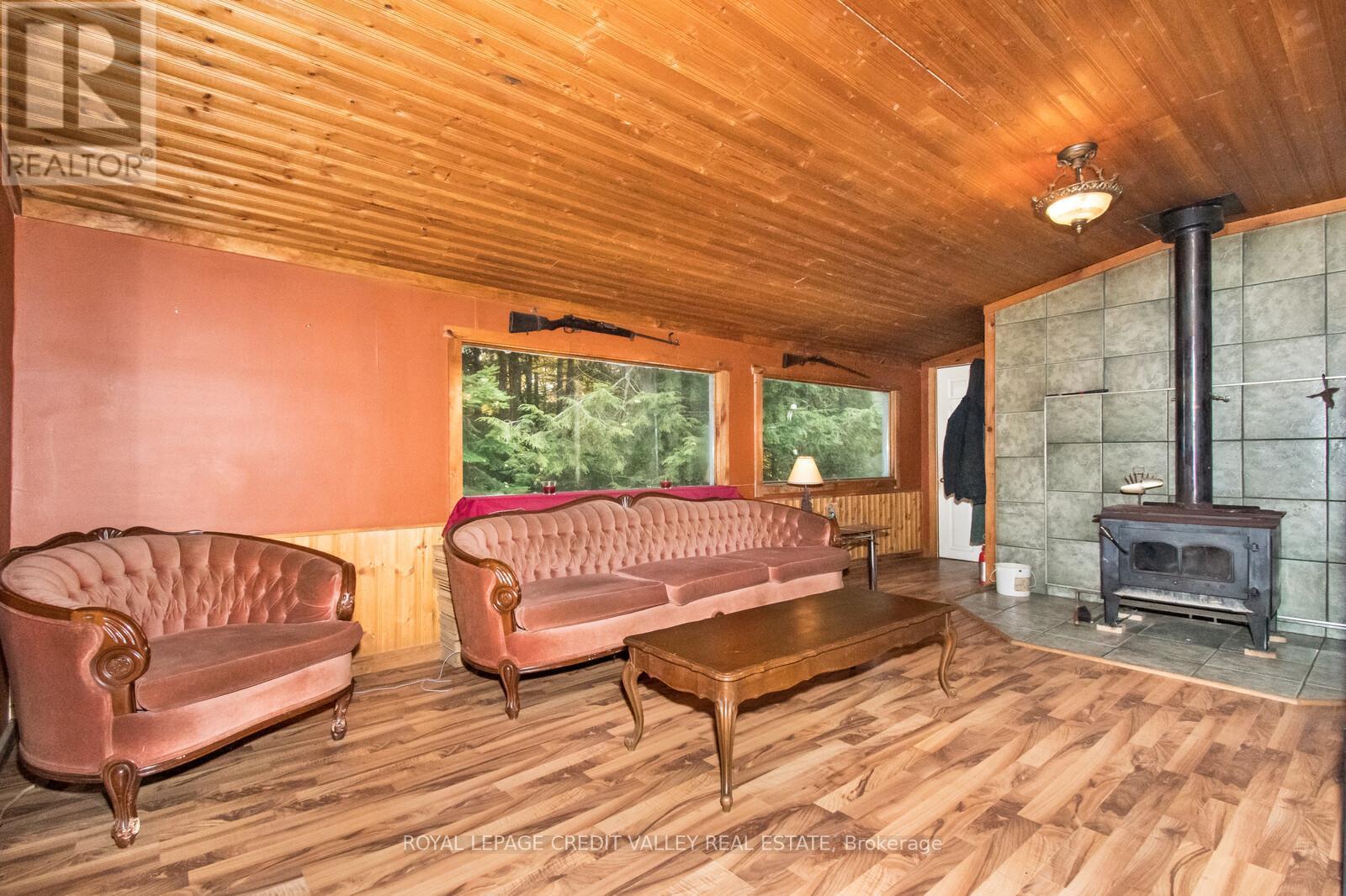 246 Hickey Trail, Hastings Highlands, ON - Photo Showing Living Room With Fireplace