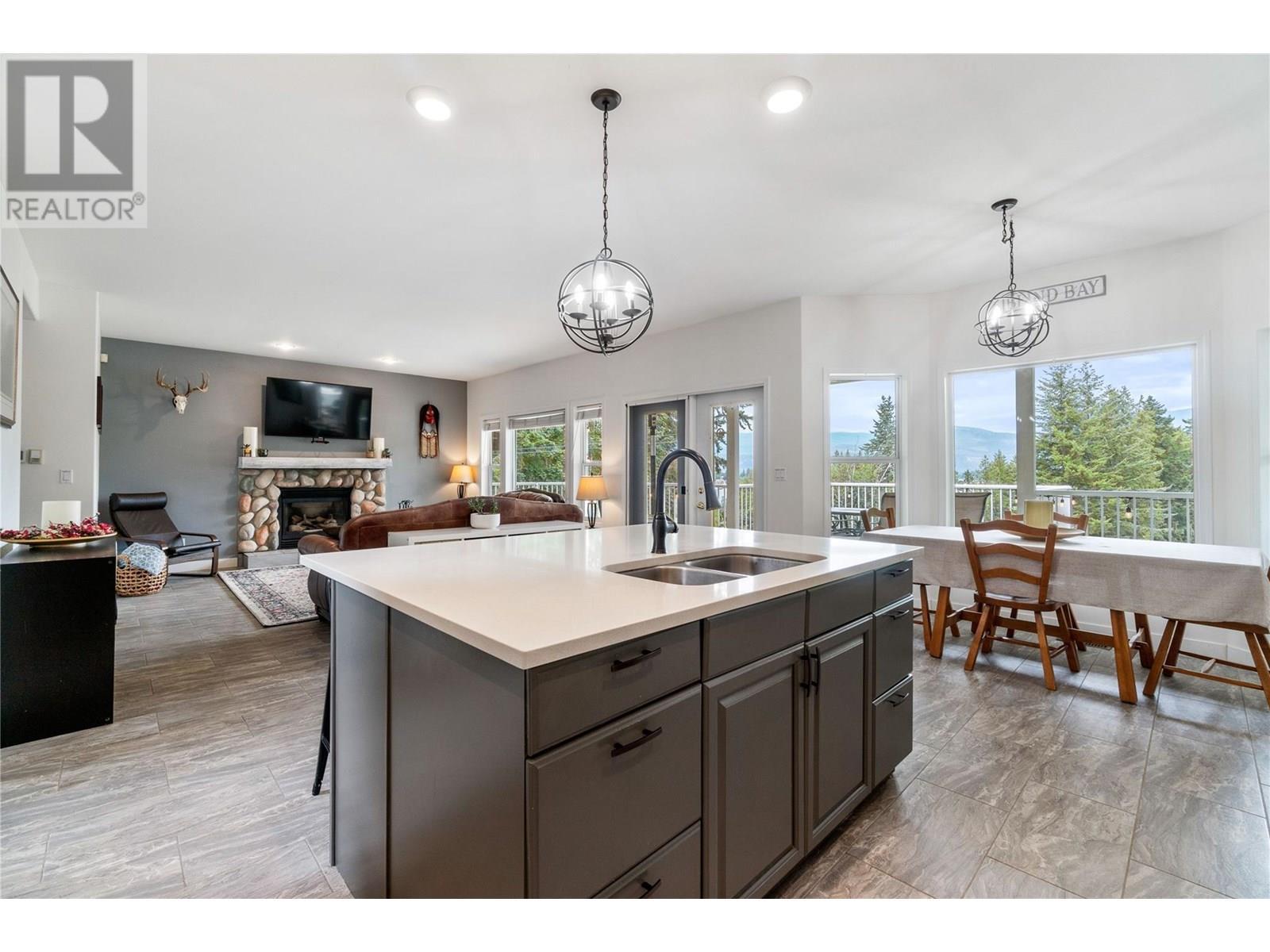 2662 Blind Bay Road, Blind Bay, BC - Indoor Photo Showing Kitchen With Fireplace With Double Sink