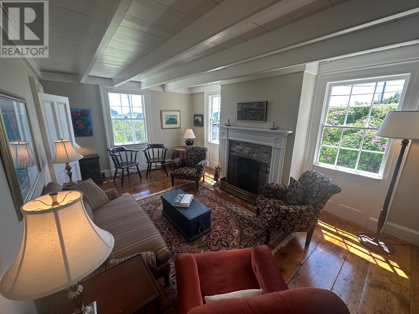 19 West Street, Trinity, NL - Indoor Photo Showing Living Room With Fireplace