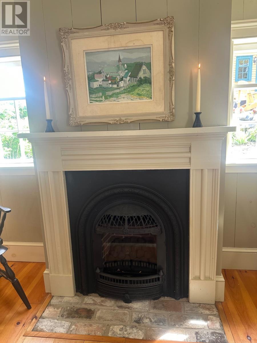 19 West Street, Trinity, NL - Indoor Photo Showing Living Room With Fireplace