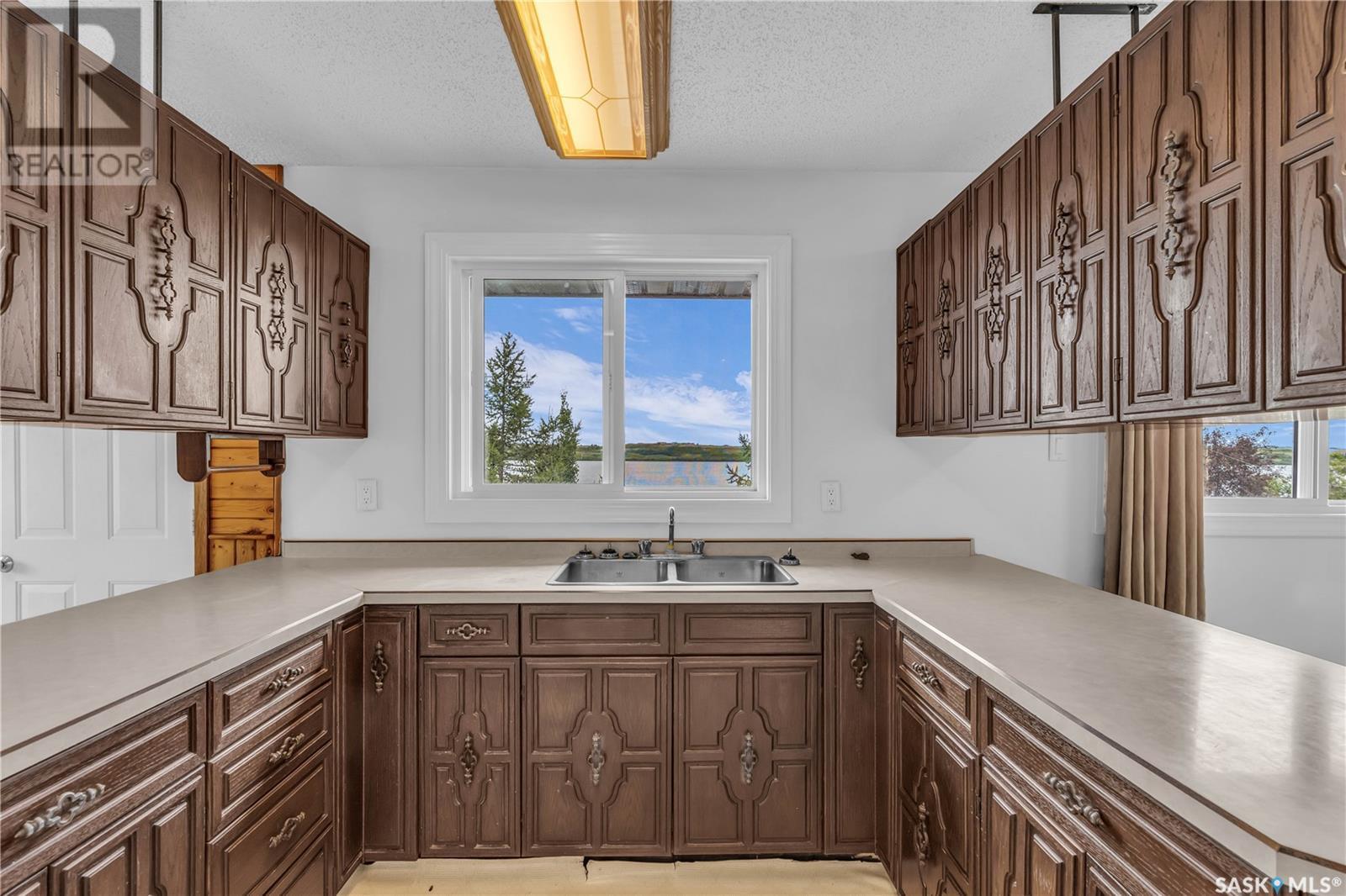 115 Boyer Drive, Meota Rm No.468, SK - Indoor Photo Showing Kitchen With Double Sink