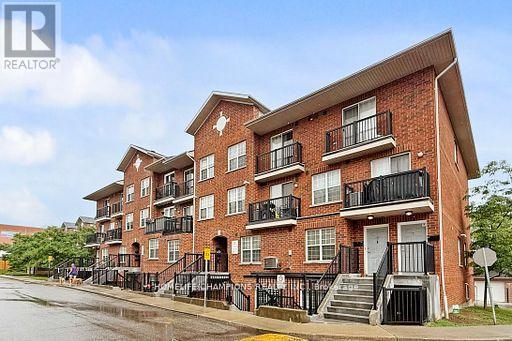 304 - 35 Strangford Lane S, Toronto, ON - Outdoor With Balcony With Facade