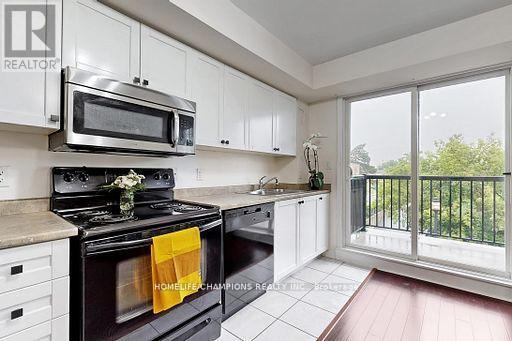 304 - 35 Strangford Lane S, Toronto, ON - Indoor Photo Showing Kitchen With Double Sink