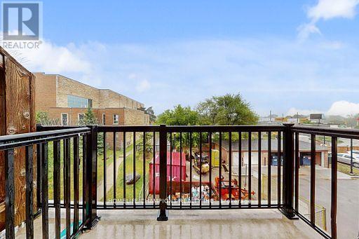 304 - 35 Strangford Lane S, Toronto, ON - Outdoor With Balcony With Exterior