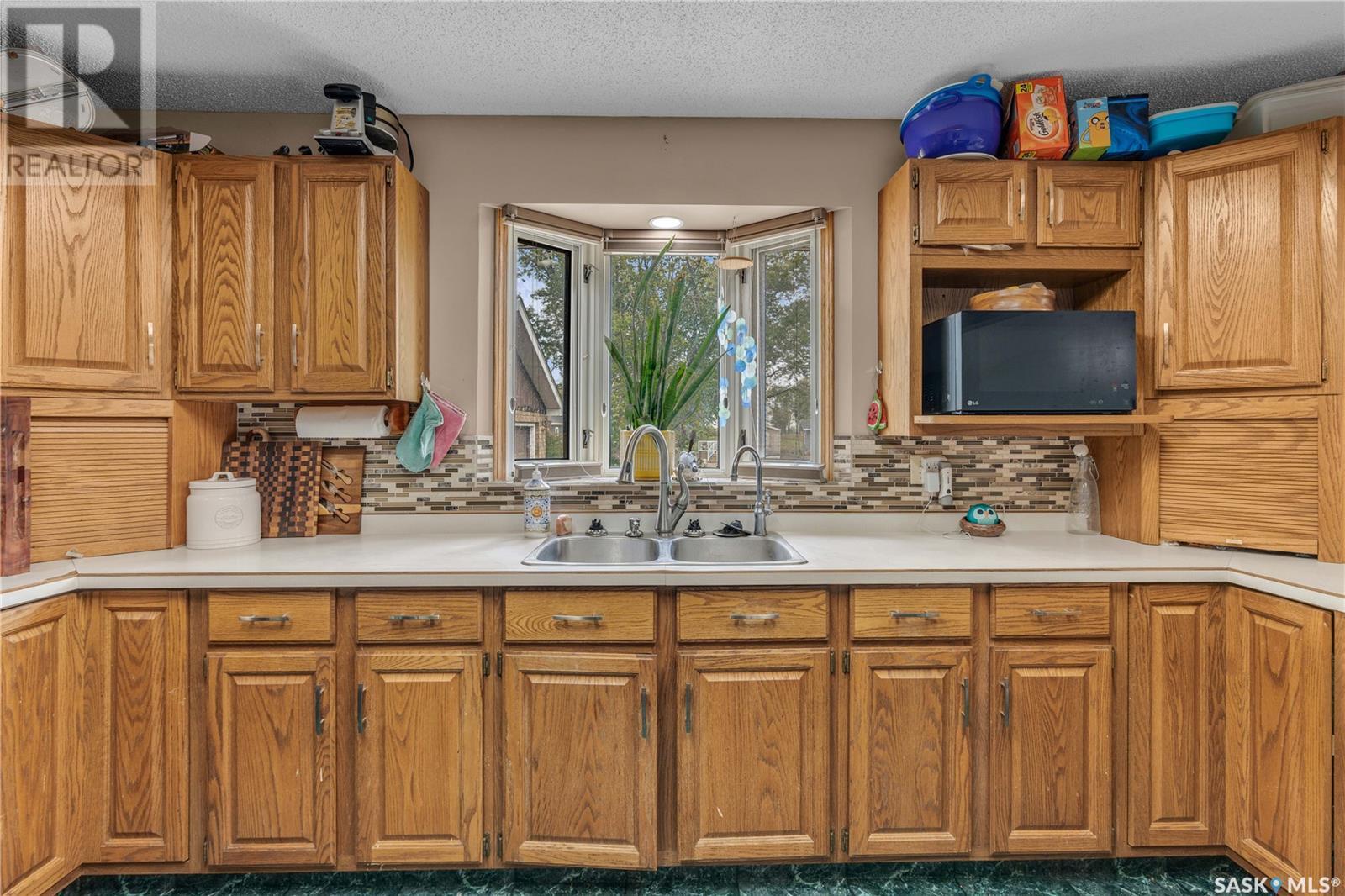 104 Railway Avenue, Dufferin Rm No. 190, SK - Indoor Photo Showing Kitchen With Double Sink