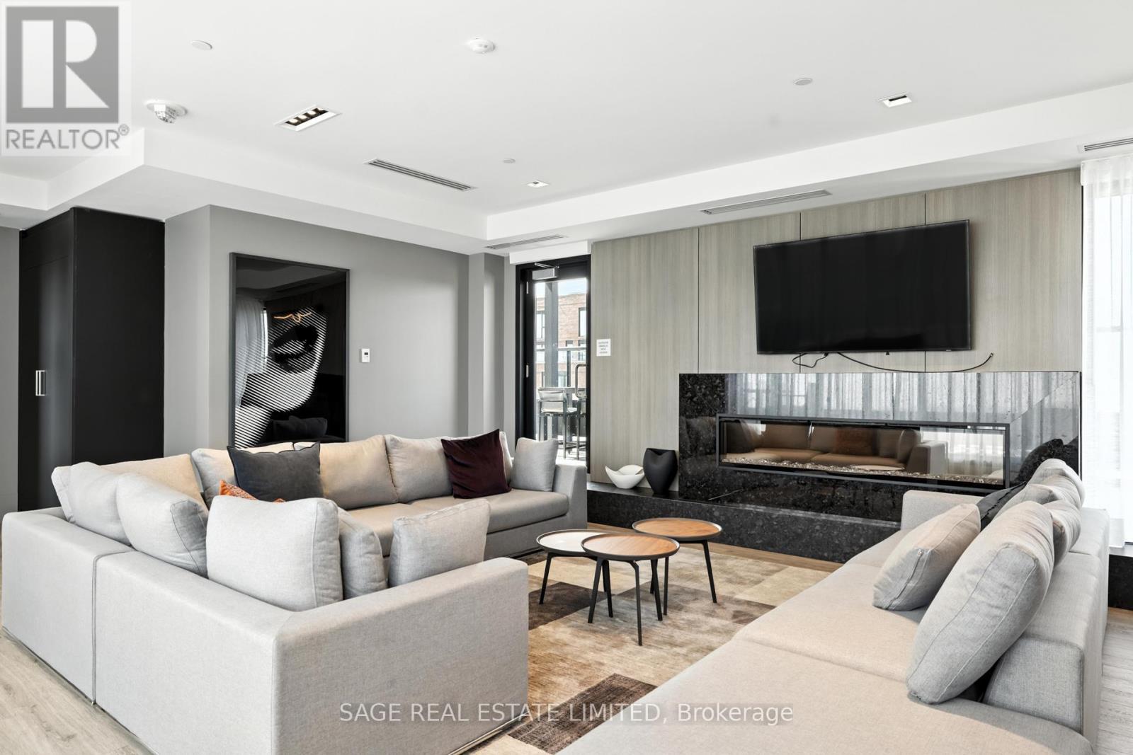 206 - 863 St Clair Avenue W, Toronto, ON - Indoor Photo Showing Living Room With Fireplace