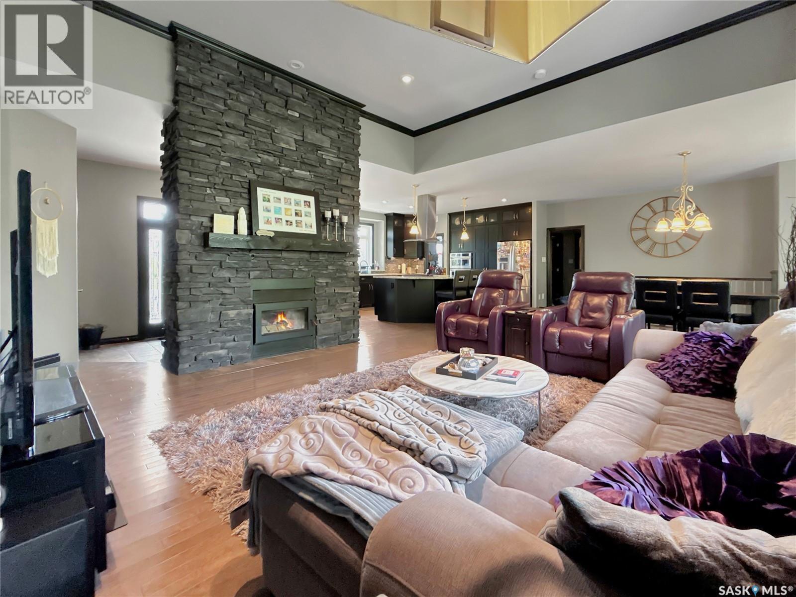 Lazy Dollar Ranch, Brock Rm No. 64, SK - Indoor Photo Showing Living Room With Fireplace