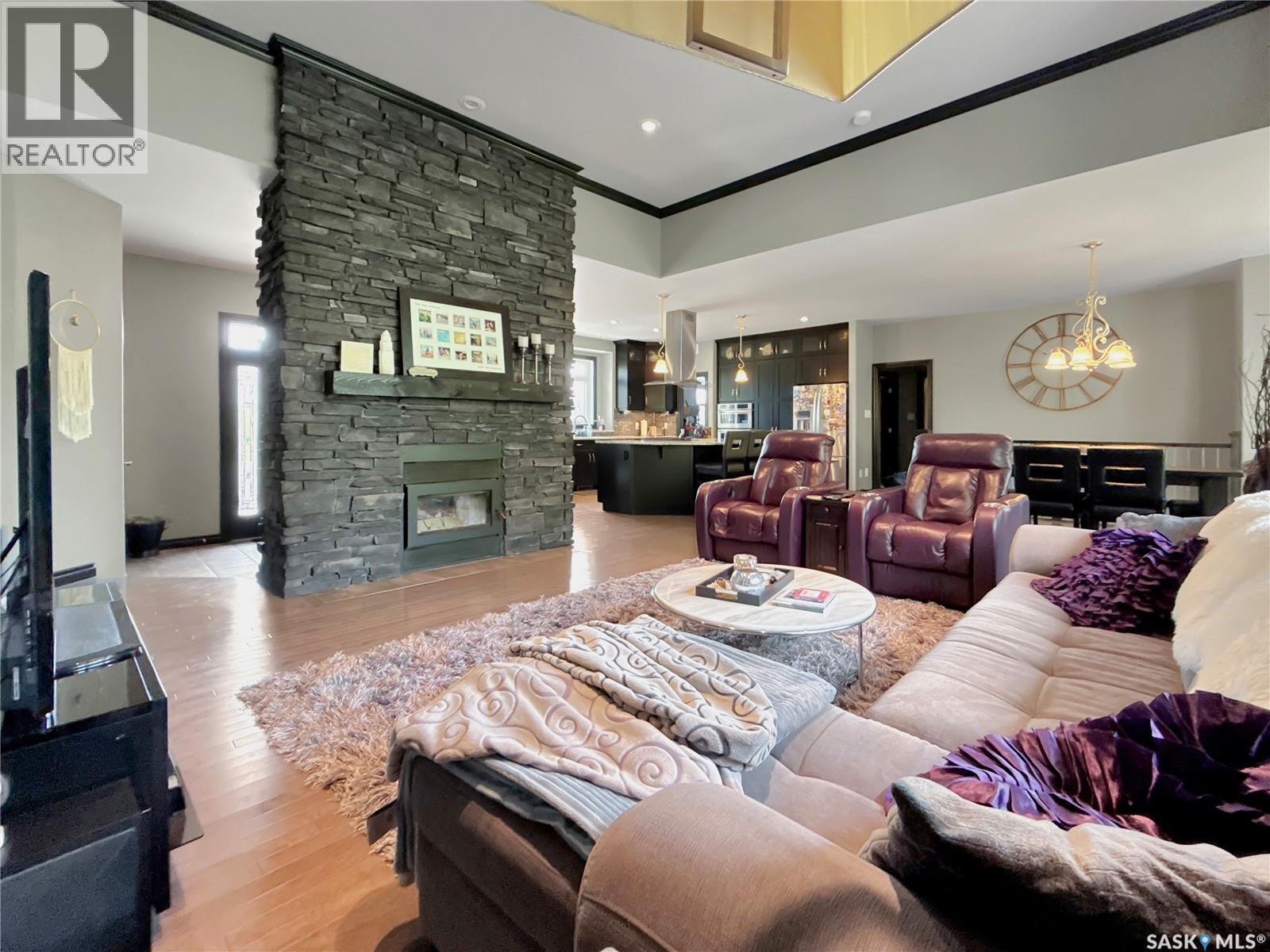 Lazy Dollar Ranch, Brock Rm No. 64, SK - Indoor Photo Showing Living Room With Fireplace