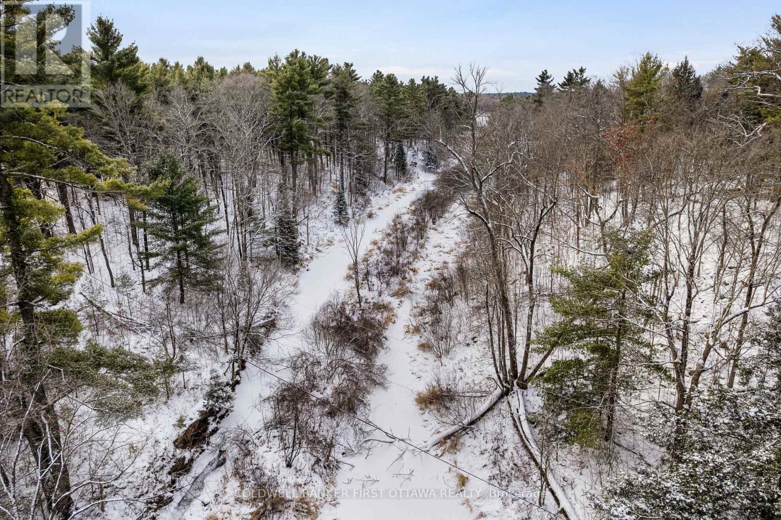 Doran Creek runs through the triangular shaped lot - 115 Doran Road, Tay Valley, ON