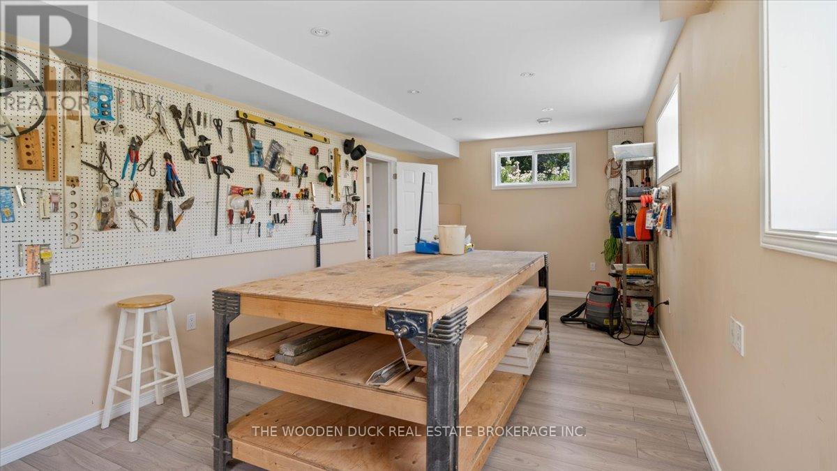 Basement Craft room with walk out - 107031 Hwy 7 Highway, Madoc, ON - Indoor Photo Showing Other Room