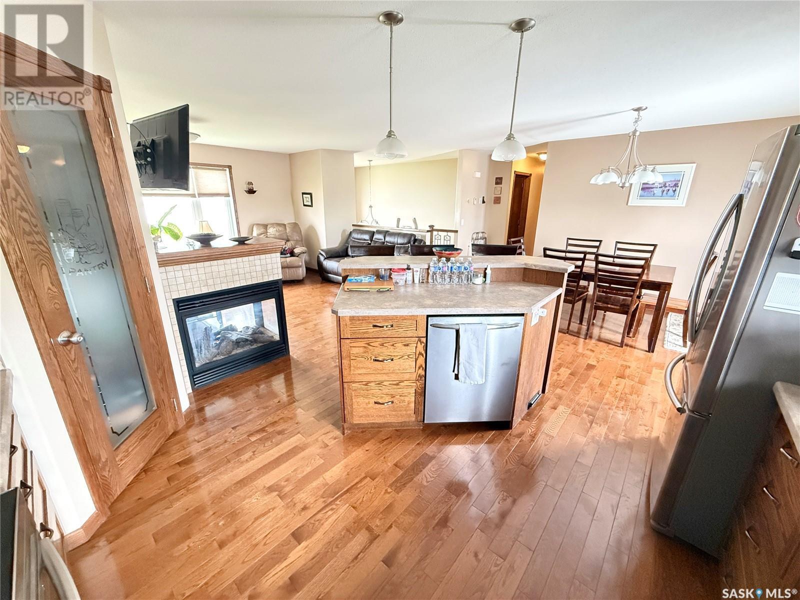 4 Island View, Cymri Rm No. 36, SK - Indoor Photo Showing Kitchen With Fireplace
