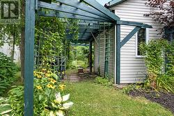 Garden shed has attached shaded pergola -