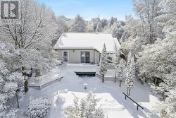 Well-maintained home tucked among trees & gardens -