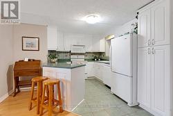 Wrap-about kitchen with chef efficiencies -