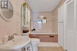 Three-piece bathroom with two-person jacuzzi tub -